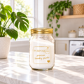 16 oz PurposeFill Premium Laundry Powder refill in a clear glass jar with gold lid in a bright laundry room in Bend, Oregon.